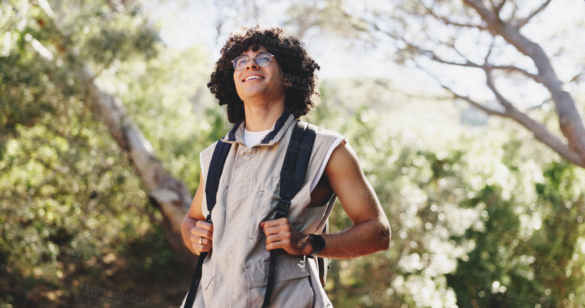 Buy stock photo Thinking, man and hiking for fitness in forest with smile, adventure and sightseeing on holiday. Bokeh, person and backpacking with reflection, trekking view and explore nature on vacation in woods
