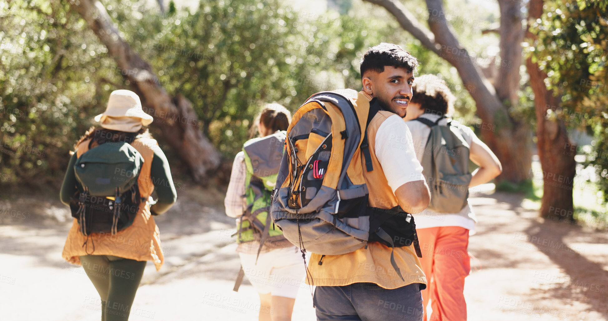 Buy stock photo Back, hiking and travel with portrait of man outdoor in forest for hobby or journey. Backpacking, trekking and walking with group of hiker people on trail in nature together for adventure or bonding