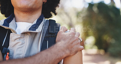 Buy stock photo Hiker, hand and hurt with shoulder pain, forest and person with muscle tension on adventure or trip. Hiking, accident and traveler with injury in nature, travel and massage for inflammation and sore