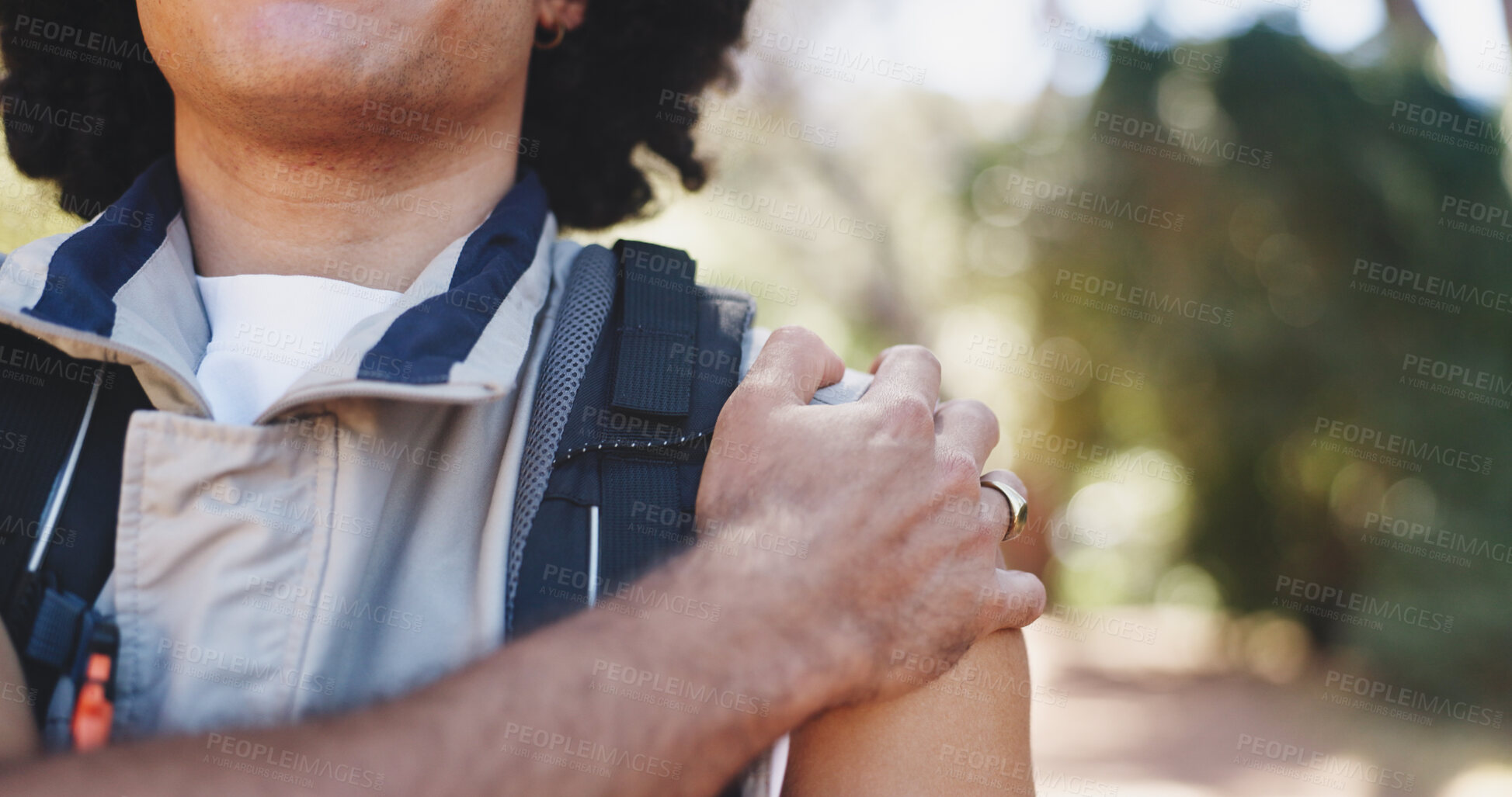 Buy stock photo Hiker, hand and hurt with shoulder pain, forest and person with muscle tension on adventure or trip. Hiking, accident and traveler with injury in nature, travel and massage for inflammation and sore