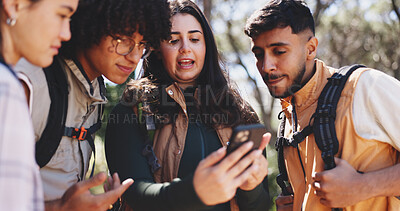 Buy stock photo Outdoor, friends and reading with mobile for hiking, route navigation and online trail map for trekking. Location app, national forest site or people with phone for backpacking, talking or directions