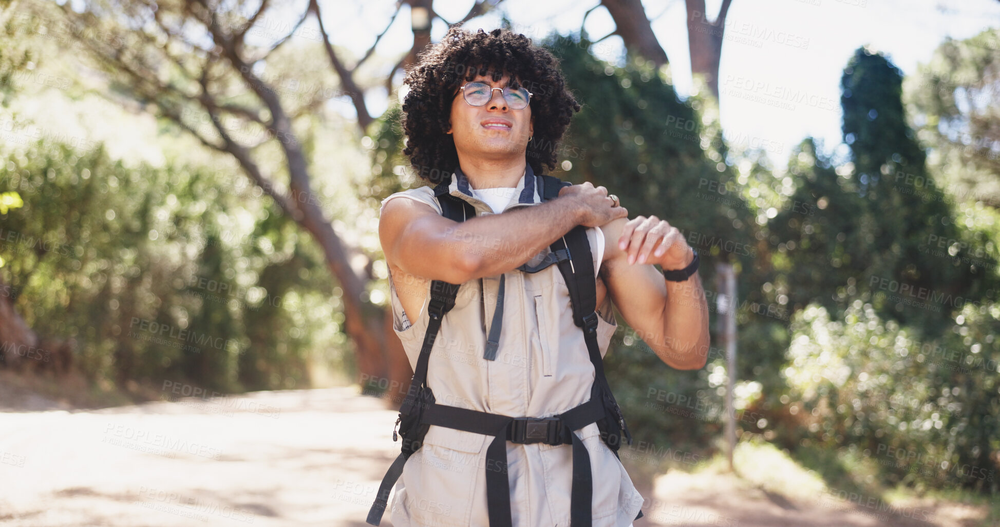 Buy stock photo Hiker, hurt and man with shoulder pain, forest and sore with muscle tension on adventure and travel. Outdoor, accident and person with injury in nature, hiking and massage for joint strain in woods