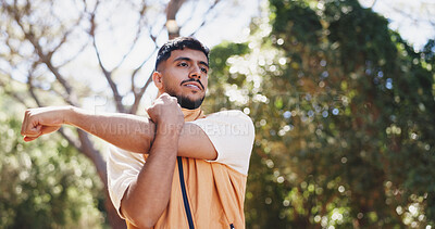 Buy stock photo Outdoor, fitness and man with stretching for hiking, warm up routine or prepare for trekking exercise. Getting ready, wellness practice or person with workout for start, nature training or low angle