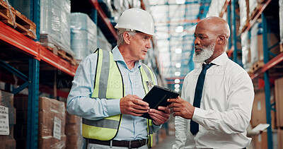 Buy stock photo Warehouse, discussion and men with tablet, logistics or team with stock distribution schedule on web. Colleagues, talk and mature people with tech for delivery update, shipping and meeting in factory