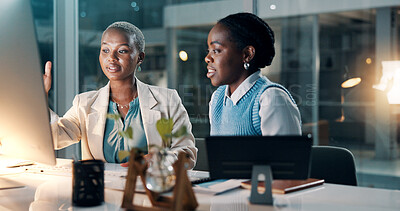 Buy stock photo Night, women and discussion in office with computer, financial review and deadline for company audit. Late, black people and talk in workplace with desktop, finance report or planning for accounting.
