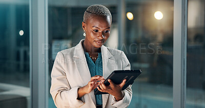 Buy stock photo Night, reading or black woman in office with tablet, draft edit or source feedback for article. Bokeh, space or journalist in agency with tech, fact check or industry research in late shift.