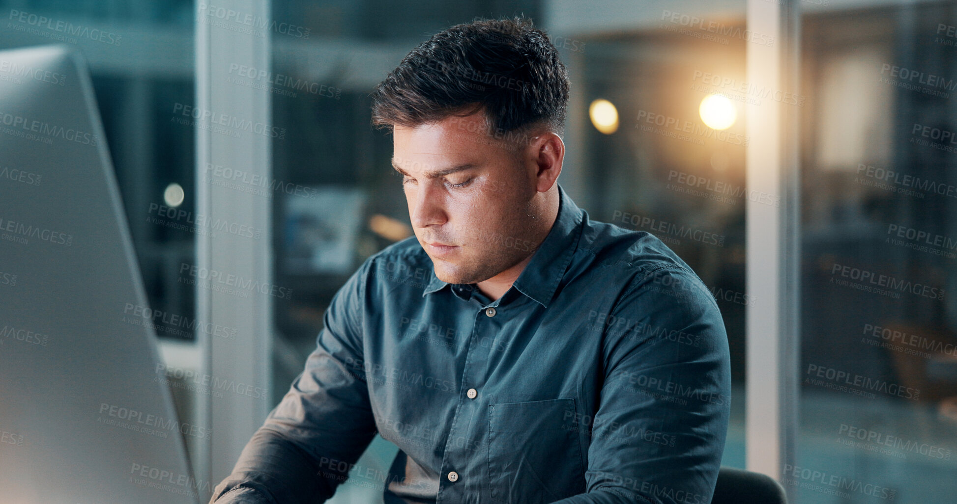 Buy stock photo Business, man and computer in office at night for news research, editing draft or publication deadline. Overtime, journalist or tech at media agency for editor feedback, article planning or blog post