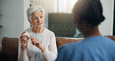 Buy stock photo Consulting, healthcare and pills of old woman with nurse on sofa for help or home appointment. Feedback, medical or prescription of patient with caregiver in apartment for assisted living questions