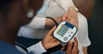 Hands, nurse and blood pressure monitor for patient with test, service or results for wellness check. Caregiver, senior person and screen for assessment, healthcare exam or retirement in nursing home