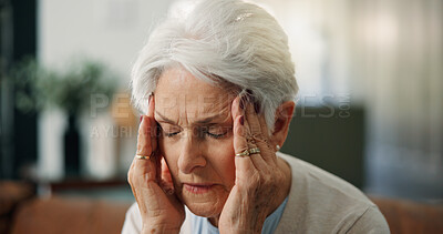 Buy stock photo Home, pain and senior woman with headache, burnout or stress for financial insecurity in living room. Mental health, reflection and elderly person with migraine, massage and anxiety for retirement