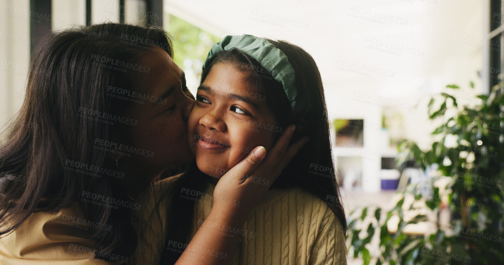 Buy stock photo Cheek kiss, mom and daughter in house with love, motherhood and bonding together for child growth. Mothers Day, woman and kid with happiness, healthy relationship or connection in emotional security.