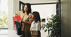 Mother, daughter and packing in home with backpack, morning routine or getting ready for back to school. Caring mom, child and preparation in house with bag, support or help for elementary education.
