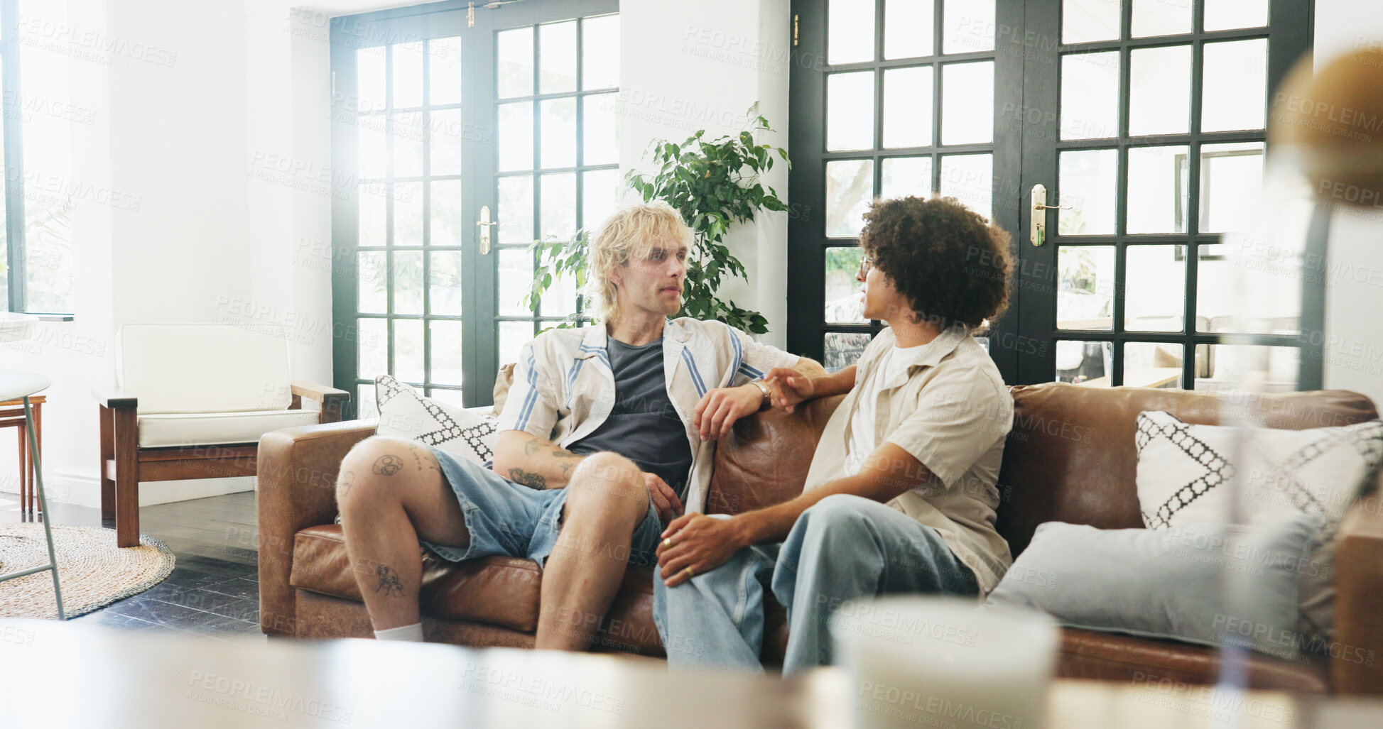 Buy stock photo Friends, conversation and relax in lounge for bonding,  reunion gossip and catch up session. Speaking, storytelling and people chill together for weekend visit in home, men and listening for support