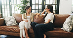 Women, conversation and relax in living room for reunion, share gossip and chat for bonding session. Speaking, listening and friends together for weekend visit in home, people and smile for support