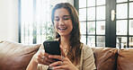 Girl, phone and smile on couch with typing, communication or texting in home. Woman, tech and contact in living room with connection, social media update or weekend planning on sofa with networking