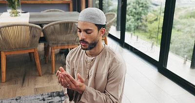 Buy stock photo Muslim, man and praying with dua at house for faith, praise Allah and spiritual worship in Ramadan. Male person, thobe and prayer with salah, religious practice and devotion to God for Islamic belief