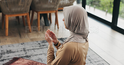 Buy stock photo Back, woman and praying with dua at house for faith, praise Allah and spiritual worship in Ramadan. Muslim, person and prayer with salah, religious practice and devotion to God for islamic belief
