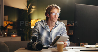 Buy stock photo Man, photographer and computer in home at night for editing, review images and content creator. Male person, technology and website for digital art, check quality and working late of media production