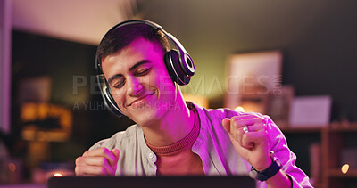 Buy stock photo Laptop, musician and dance with headphones for production, audio or listen to music track. Computer, man and streaming song with tech for content creator, subscription and neon light at night in home