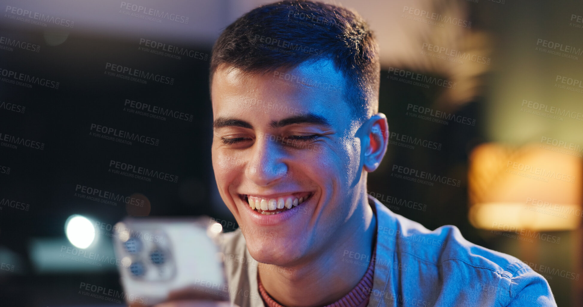 Buy stock photo Night, happy man and scroll in office with phone, text message and online dating site notification. Late, person and smile in workplace with technology, digital communication and social media update.