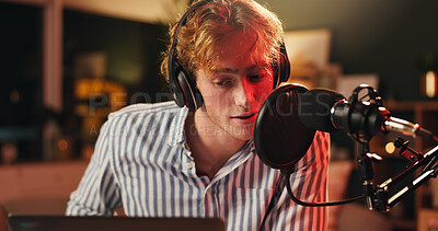 Buy stock photo Content creator, man and laptop with mic for podcast, recording or night broadcast for radio host dj. Live streaming, headphones or streamer with script for online interview or discussion on tech