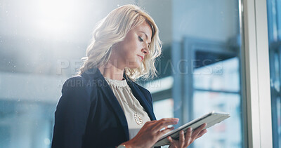 Buy stock photo Serious, employee and woman with tablet, office and search on web, scroll and real estate investment. Realtor, online and person with tech for property listing, flare and sale opportunity on app