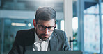 Reading, glasses and businessman in office with laptop for research on coding project with IT. Computer, professional and male software engineer with report for website programming in workplace.