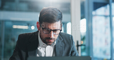 Buy stock photo Reading, glasses and businessman in office with laptop for research on coding project with IT. Computer, professional and male software engineer with report for website programming in workplace.
