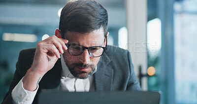 Buy stock photo Reading, glasses and businessman in office with computer for research on coding project with IT. Laptop, professional and male software engineer with report for website programming in workplace.