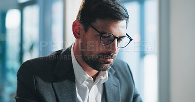 Buy stock photo Reading, glasses and businessman in office with project for research on coding review with IT. Spectacles, professional and male software engineer with report for website programming in workplace.