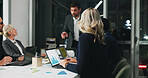 Night, meeting and woman in office with laptop, business people and graphs at digital agency. Technology, overtime and team with planning, management review and paperwork for working late and report