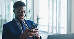 Phone, smile and typing with business black man in office for communication, corporate finance or update. App, text message and laptop with happy African employee in financial workplace for feedback