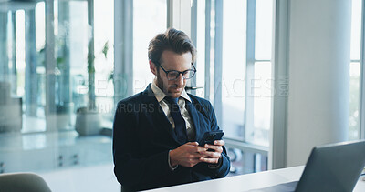 Buy stock photo Business, laptop and phone with man in office for communication, corporate finance or update. Computer, text message and typing with employee at desk in financial workplace for mobile feedback