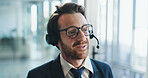 Call center, help and man in office with headset, contact us or advice in crm service. Professional, space and consultant in agency with tech, online assistance or feedback in client support.