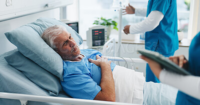 Buy stock photo Nurse, tablet and senior man in hospital bed for surgery recovery, medical assessment or chest pain. Healthcare staff, old patient and professional with tech for checkup and angina healing discomfort