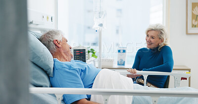 Buy stock photo Old couple, smile and conversation by hospital bed for support, compassion or empathy for recovery. Married, elderly people and happy in medical clinic with care, chat or good news for health update.