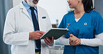 Hands, doctors and tablet for discussion at clinic with review, checklist and insight for medical report. People, nurse and surgeon with tech, app and feedback with healthcare services at hospital