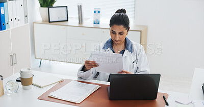 Buy stock photo Documents, laptop and medical with doctor in office at hospital for online planning or research. Computer, healthcare and paperwork with Indian woman in clinic for administration or report from above