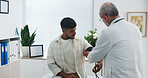 Blood pressure, consultation and doctor with man in hospital for medical service or support. Advice, checkup and healthcare worker with male patient for monitoring pulse with hypertension in clinic.