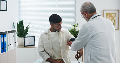 Buy stock photo Blood pressure, consultation and doctor with man in hospital for medical service or support. Advice, checkup and healthcare worker with male patient for monitoring pulse with hypertension in clinic.
