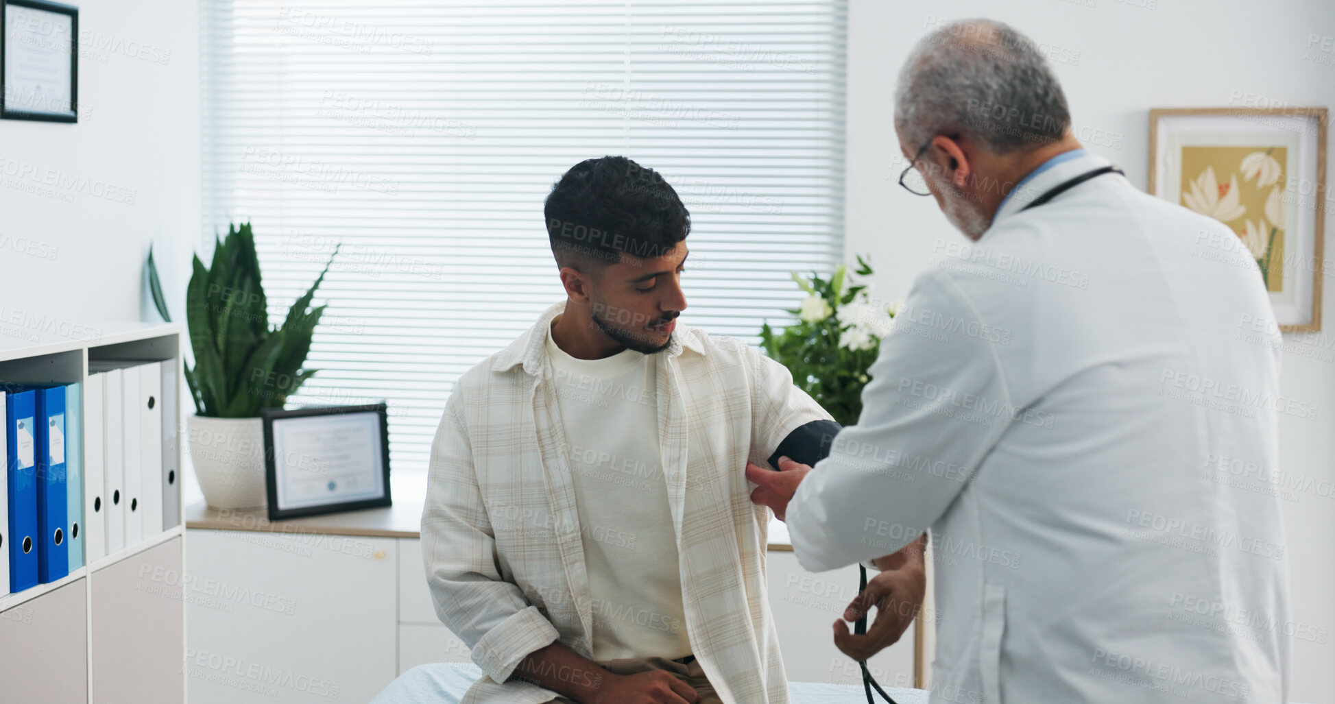 Buy stock photo Blood pressure, consultation and doctor with man in hospital for medical service or support. Advice, checkup and healthcare worker with male patient for monitoring pulse with hypertension in clinic.