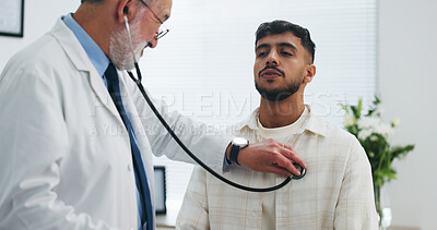 Buy stock photo Doctor, man and breathe in office with stethoscope, heart assessment and cardiology exam for advice. People, healthcare worker and patient in clinic with medical equipment, chest evaluation and help.