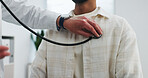 Doctor, hand and man with stethoscope, chest assessment and cardiology evaluation for medical advice. People, healthcare worker and patient in clinic with equipment, asthma test or heart examination.