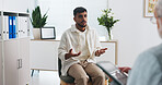Consultation, healthcare and man in clinic, talking and feedback for test results. Patient, medical service and professional in office, discussion and appointment for advice, wellness and support