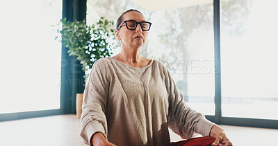 Buy stock photo Yoga, woman and calm with meditation in studio for holistic wellness, spiritual healing or inner peace. Zen, mature female person or breathing on floor for mental health, mindfulness or stress relief