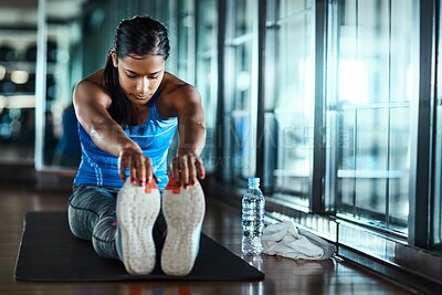 Buy stock photo Workout, girl and stretching legs at gym to start exercise, fitness routine and getting ready. Health club, woman and warm up on mat for training preparation, muscle coordination and enhance posture