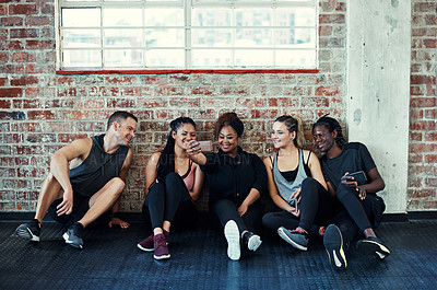 Buy stock photo Happy, friends and selfie in gym, fitness and bonding on break, memory and post for social media app. Online, photography and people with smile for profile picture and rest after exercise routine