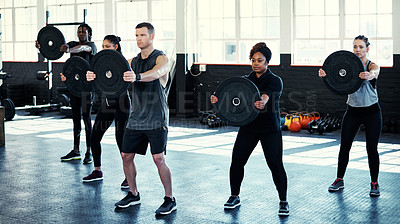 Buy stock photo Fitness, weightlifting or athletes in gym class with plates, challenge or cross fit in bodybuilding. Exercise, endurance or people with equipment, group session or intense workout for muscle gain.
