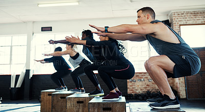 Buy stock photo Class, workout and squat with people on box for fitness, gym equipment and bodybuilder. Wellness, exercise club and plyometric training with group of friends in sports center for platform and health