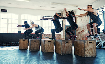 Buy stock photo Class, fitness and box jump with people in gym for workout, equipment and bodybuilder. Wellness, exercise club and plyometric training with group of friends in sports center for platform and health